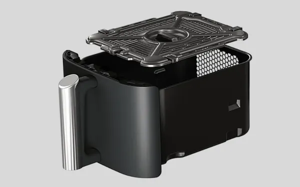 На вийнятій шухляді з аерофритюрниці Ninja видно ручку та решітку гриля, підняту над контейнером.