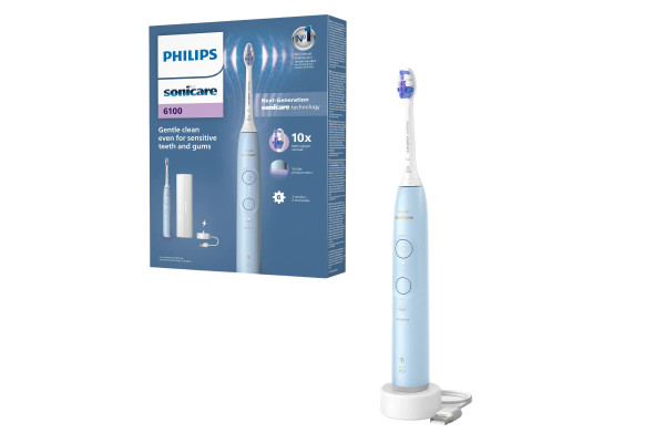 Електрична зубна щітка Philips Sonicare HX7406/02 із зарядним пристроєм поруч із упаковкою продукту