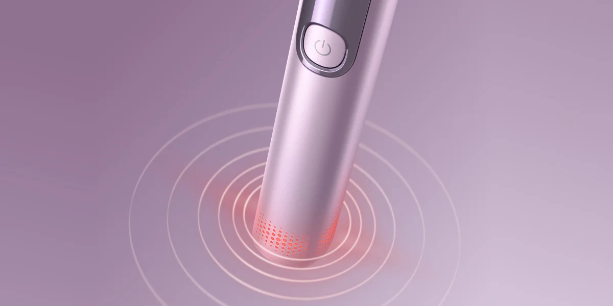 Нижня частина зубної щітки Philips Sonicare з червоним підсвічуванням та вібраційними колами