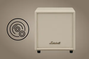 Кремовий сабвуфер Marshall із значком живлення