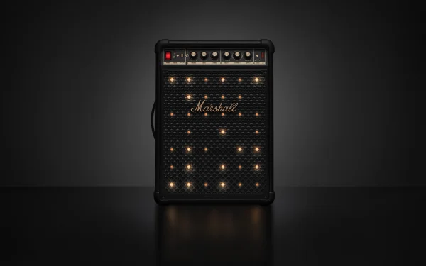 Динамік Marshall з підсвіченою передньою панеллю на темному фоні